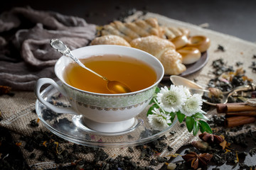 Tea hot drink on old background in composition on the table