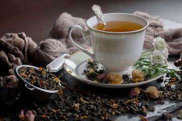 Tea hot drink on old background in composition on the table