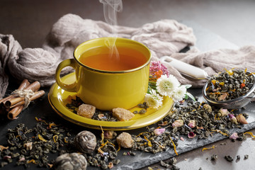 Tea hot drink on old background in composition on the table