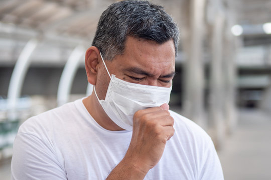 allergic sick old man coughing with sore throat; concept of man with allergy, phlegm, sore throat or throat inflammation, influenza, flu, cold, sickness, health care concept - Powered by Adobe