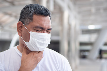 allergic sick old man having sore throat inflammation; concept of man with allergy, phlegm, sore throat or throat inflammation, influenza, flu, cold, sickness, health care concept