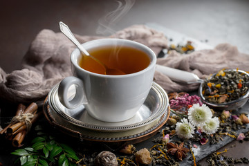 Tea hot drink on old background in composition on the table