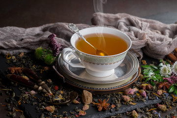 Tea hot drink on old background in composition on the table