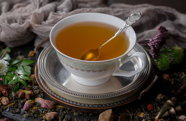 Tea in a cup on an old background