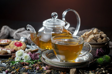 Tea hot drink on old background in composition on the table