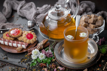 Tea hot drink on old background in composition on the table