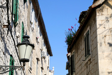 Retro style street lamp and traditional Mediterranean architecture in Split, Croatia. Selective focus.