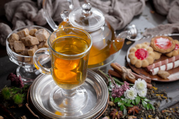 Tea hot drink on old background in composition on the table