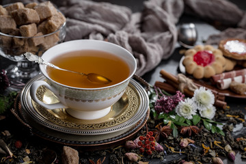 Tea hot drink on old background in composition on the table