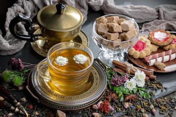 Tea hot drink on old background in composition on the table