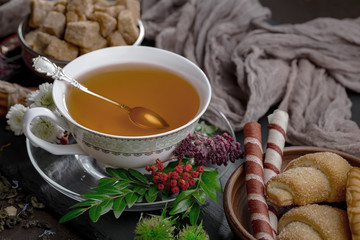 Tea hot drink on old background in composition on the table