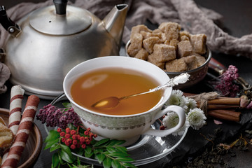 Tea in a cup on an old background