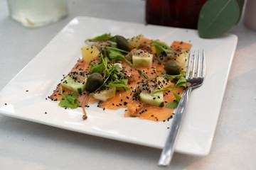 White plate with red fish