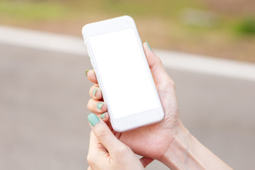 Mockup image blank white screen cell phone.man hand holding texting using mobile on desk at coffee shop.background empty space for advertise text.people contact marketing business,technology 