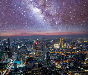 Aerial sunset view of Bangkok modern skyline on a starry night, Thailand