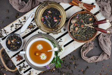 Tea hot drink on old background in composition on the table