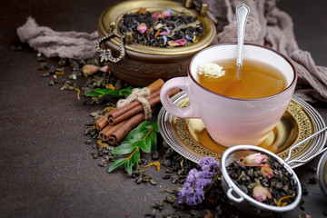 Tea hot drink on old background in composition on the table