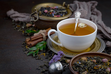 Tea hot drink on old background in composition on the table