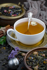 Tea hot drink on old background in composition on the table