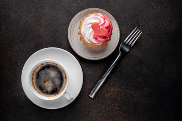 coffee and cake with drawings in the form of a heart on a stone background for Valentine's Day with copy space for your text