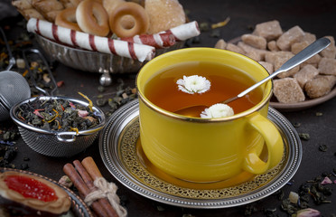 Tea hot drink on old background in composition on the table
