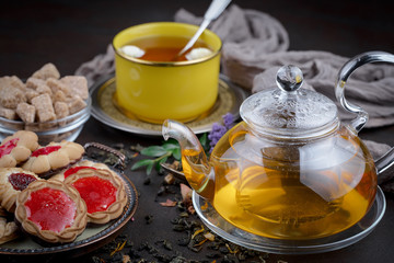 Tea hot drink on old background in composition on the table