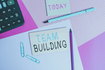 Handwriting text writing Team Building. Conceptual photo various types of activities used to enhance social relations writing equipments with stationary and plain note paper placed on the table