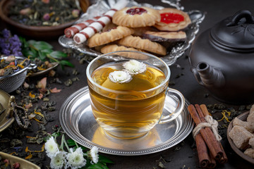 Tea hot drink on old background in composition on the table