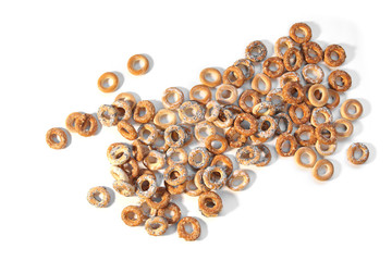 Pile of ring shaped roll cookies with different glaze isolated on white background. Bublik cookies pattern. .