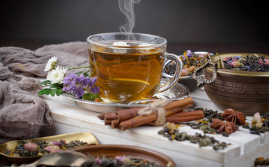 Tea hot drink on old background in composition on the table