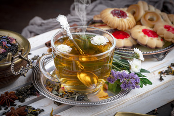 Tea hot drink on old background in composition on the table