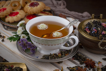 Tea hot drink on old background in composition on the table