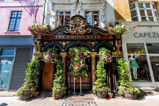 London, UK - June 26, 2018: Covent garden Neal's Yard Street famous flower decorations in summer with building and bar pub restaurant
