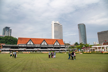 KUALA LUMPUR, MALAYSIA - DECEMBER 28, 2019: Tourists along famous Merdeka Square in Jalan Raja