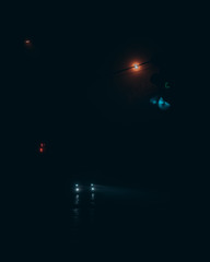 traffic light at night in the fog