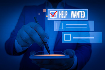 Writing note showing Help Wanted. Business concept for An ad in the paper an employer places to...
