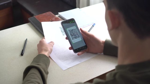 User scans the image of the QR code to display text, contact information, connect to a wireless network, or open a web page in the telephone's browser