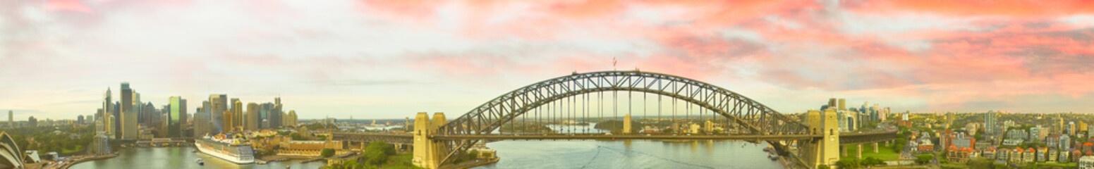 Sydney Harbour Bridge at dusk. Panoramic aerial view from drone