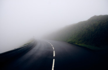 Fog on the road in the mountains. Sao Miguel Island, Azores.