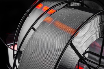 welding wire, stainless steel, on a black background