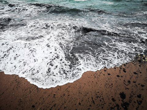 Close-up of ocean waves on beach, Bugibba, Malta