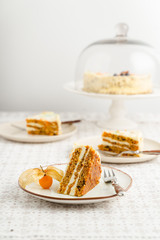Homemade carrot cake dessert served on three plates, closeup view