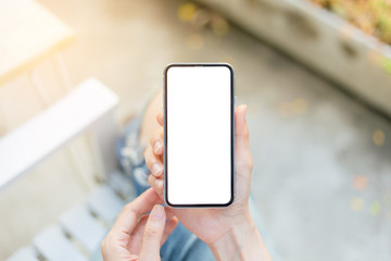 Mockup image blank white screen cell phone.man hand holding texting using mobile sitting at coffee shop.background empty space for advertise text.people contact marketing business,technology 