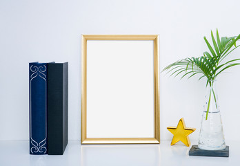 Gold frame mockup with vase and object for interior decoration. Mock up for your photo or text Place your work.