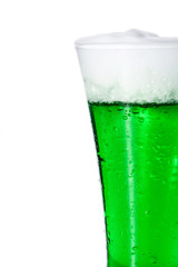 Traditional St Patrick's Day green beer isolated on white background. Copy space