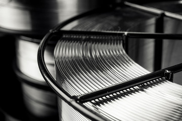 welding wire, stainless steel, on a black background