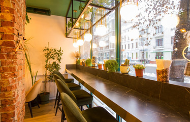 Coffee shop interior design With chairs and red bricks wall