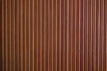 Brown wooden surface wall background. Wood texture vertical line