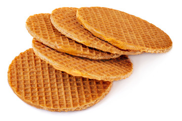  Dutch Caramel waffle with crumbs and caramel sauce, round stroopwafel isolated on a white background. Abstract sweet food concept.