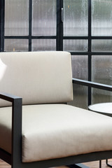 Modern white chair in a sunroom
